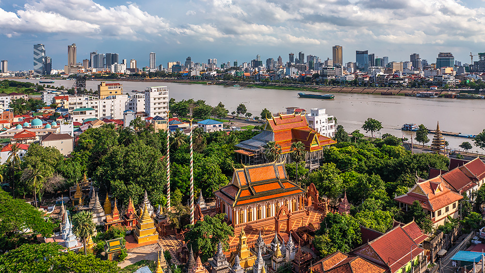 Drone Aerial view of Buddhist pagoda and Phnom Penh skyline from Chroy Changvar | Drone Aerial Photographer in Cambodia