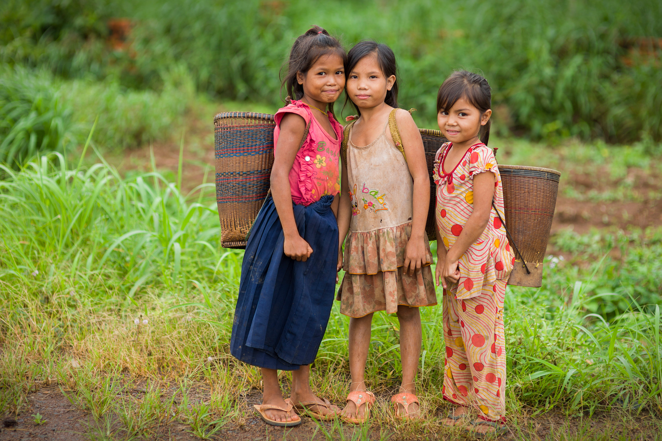 Ethnic minority children with traditional baskets in Ratanakiri province, Cambodia
