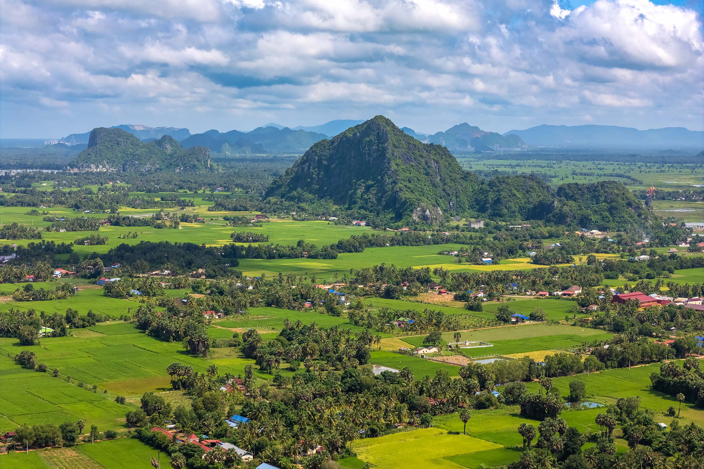 Aerial view of rice fields and karst mountains in the Cambodian countryside of Kep and Kampot | Professional Drone Photographer in Cambodia
