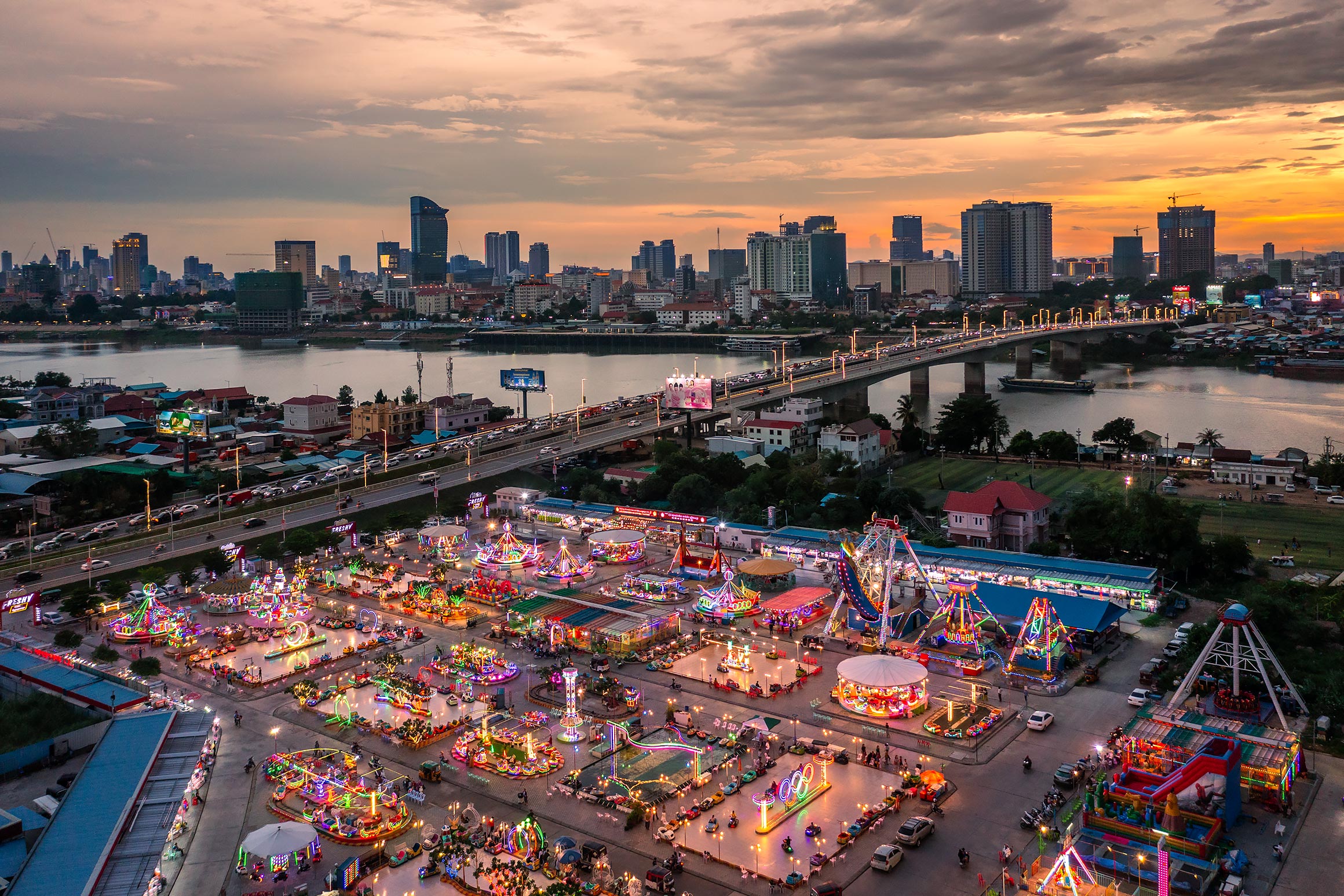 Aerial of fairground at Chroy Changvar in Phnom Penh at dusk | Freelance Drone Photographer in Cambodia