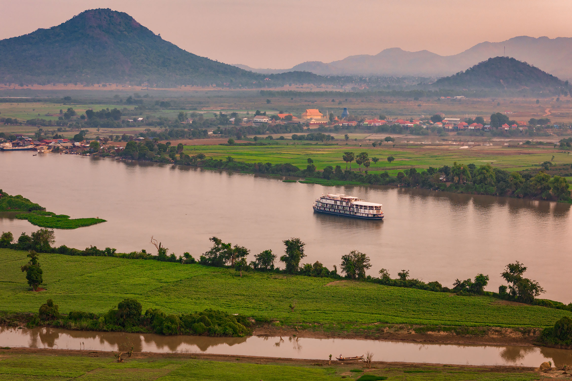 Cruise boat on scenic Cambodian river | Aerial Photographer in Cambodia